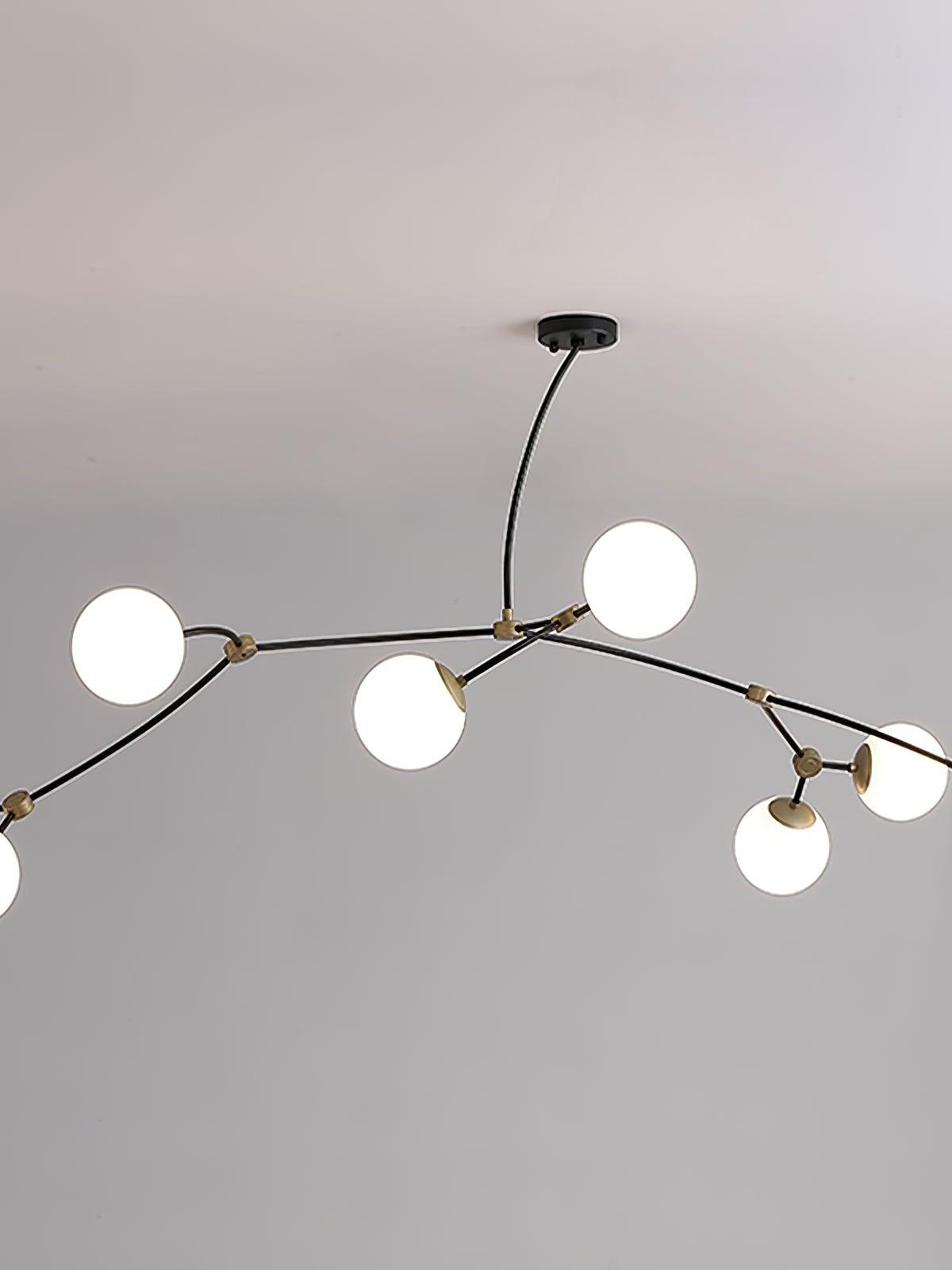 White glass globes spread along wide curved black chandelier arms