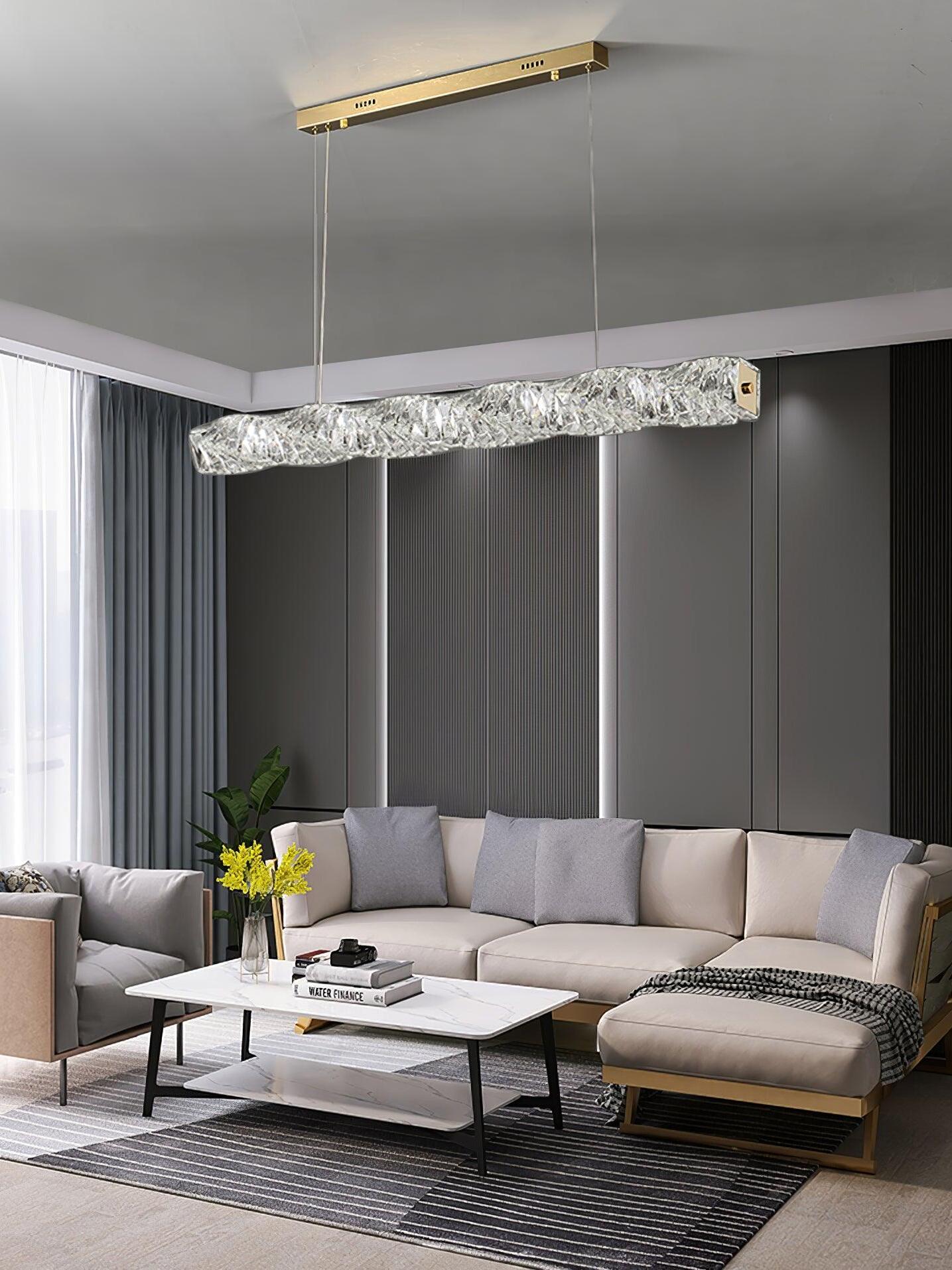 Gold canopy with a cool-looking crystal bar above a grey sofa and low coffee table