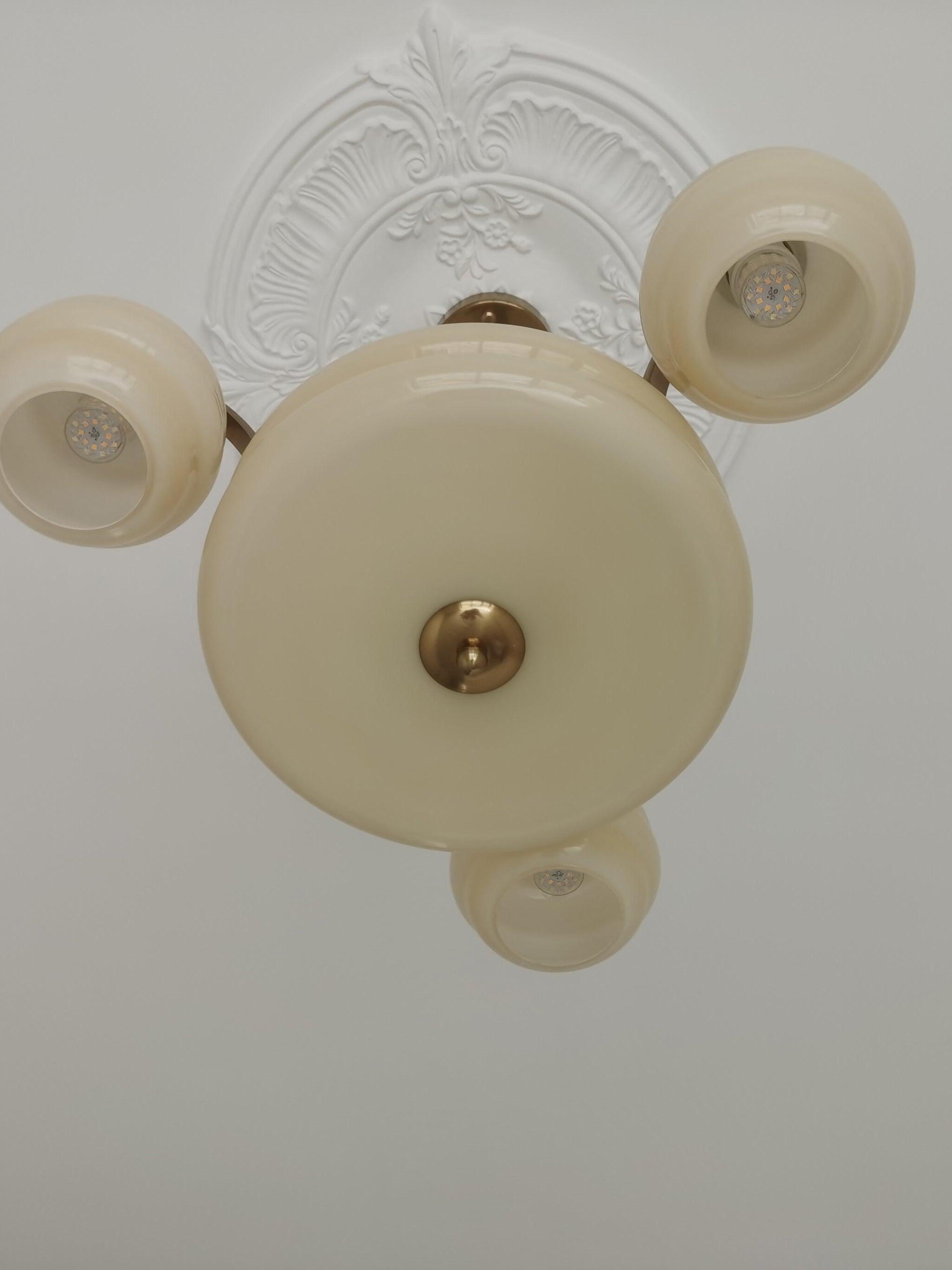 Underside of central bowl and three surrounding shades