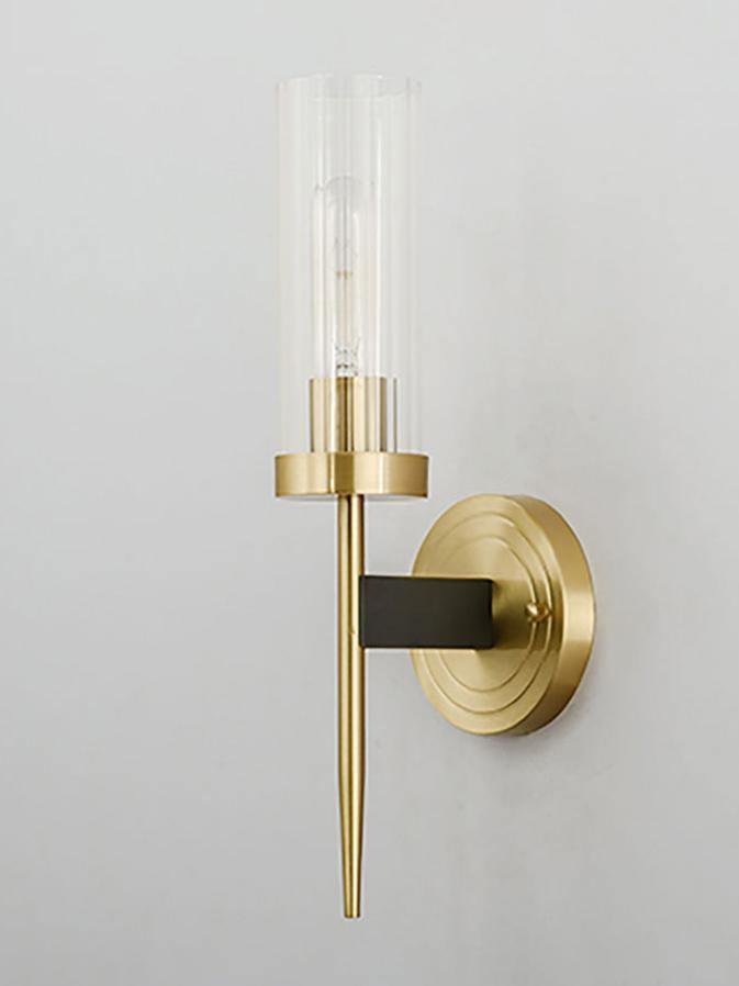 Single glass cylinder above a brass-coloured cup