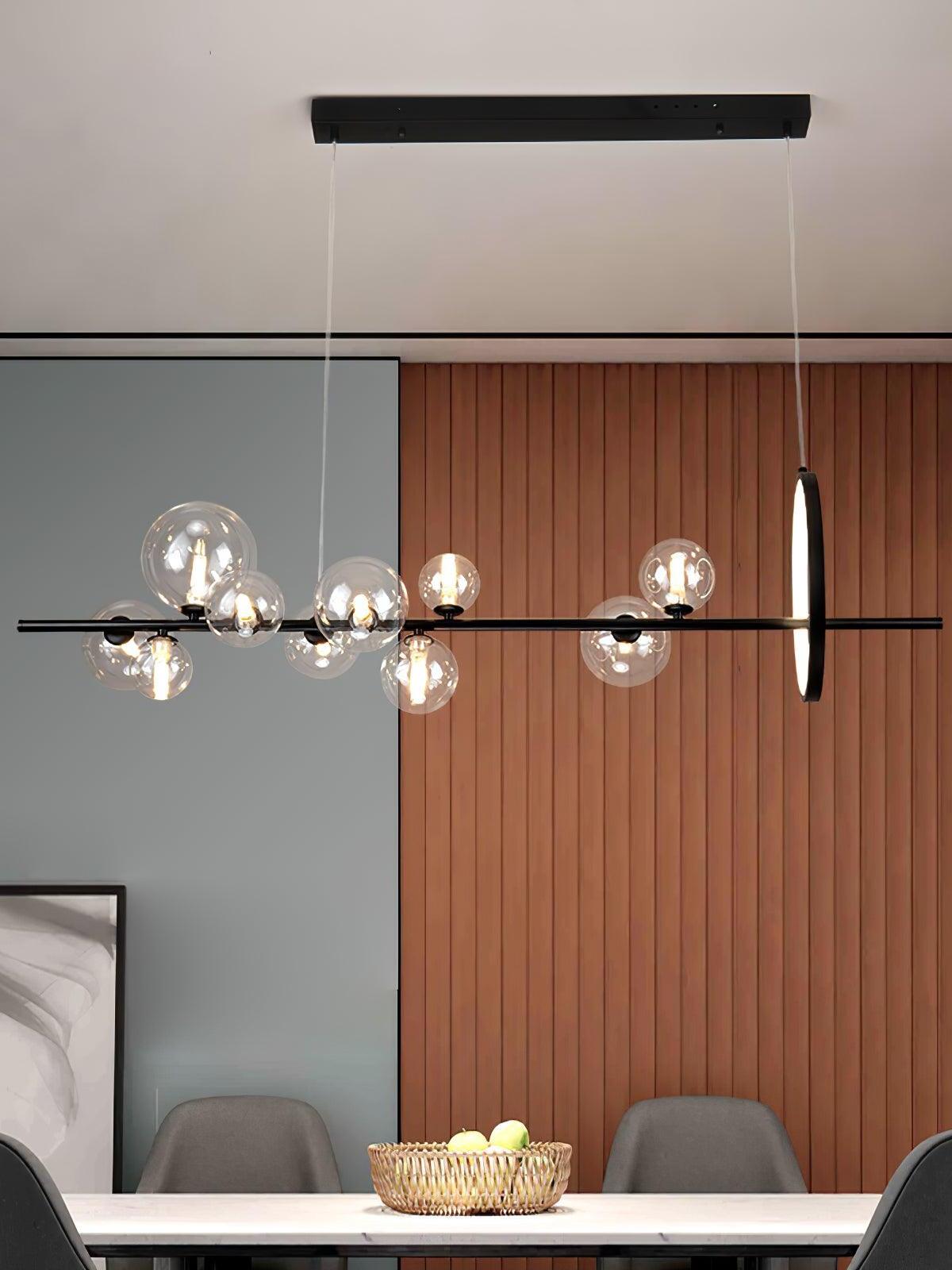 Glass globe chandelier above a table beside a wood-panelled wall