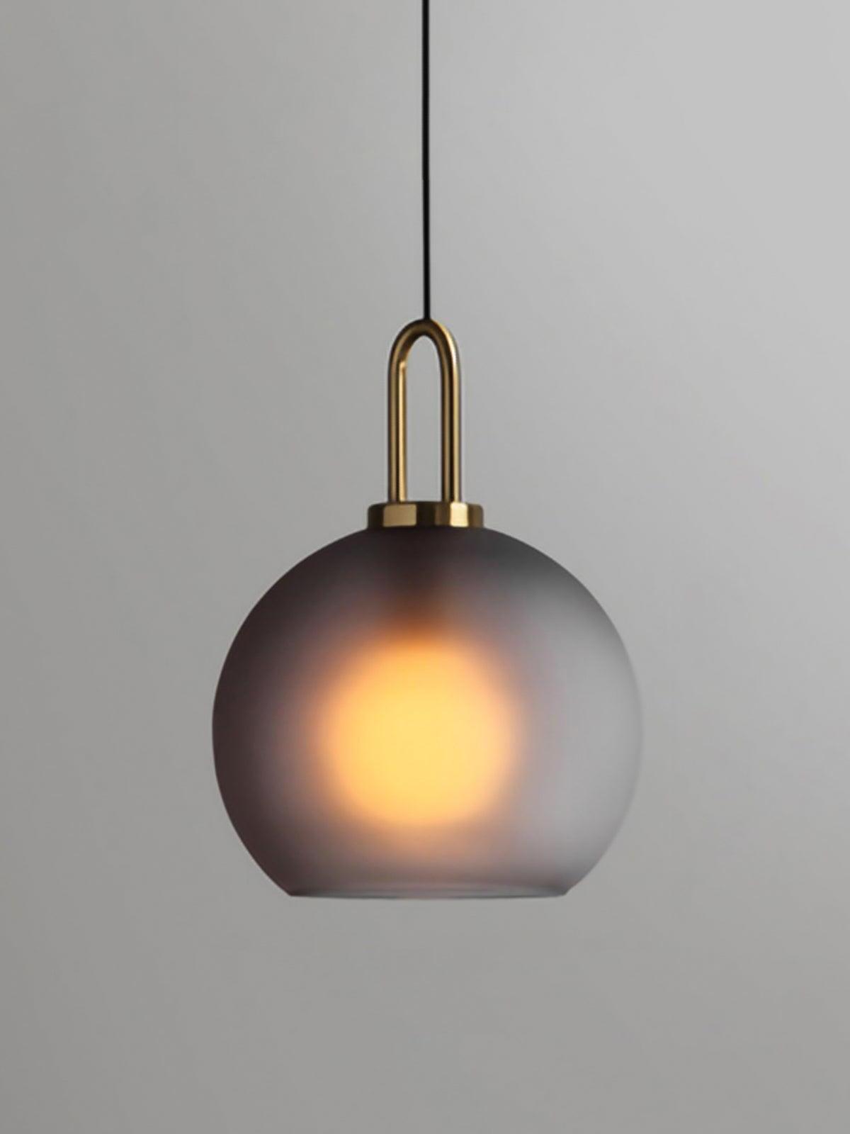 Frosted rounded glass shade with a metal loop fitting