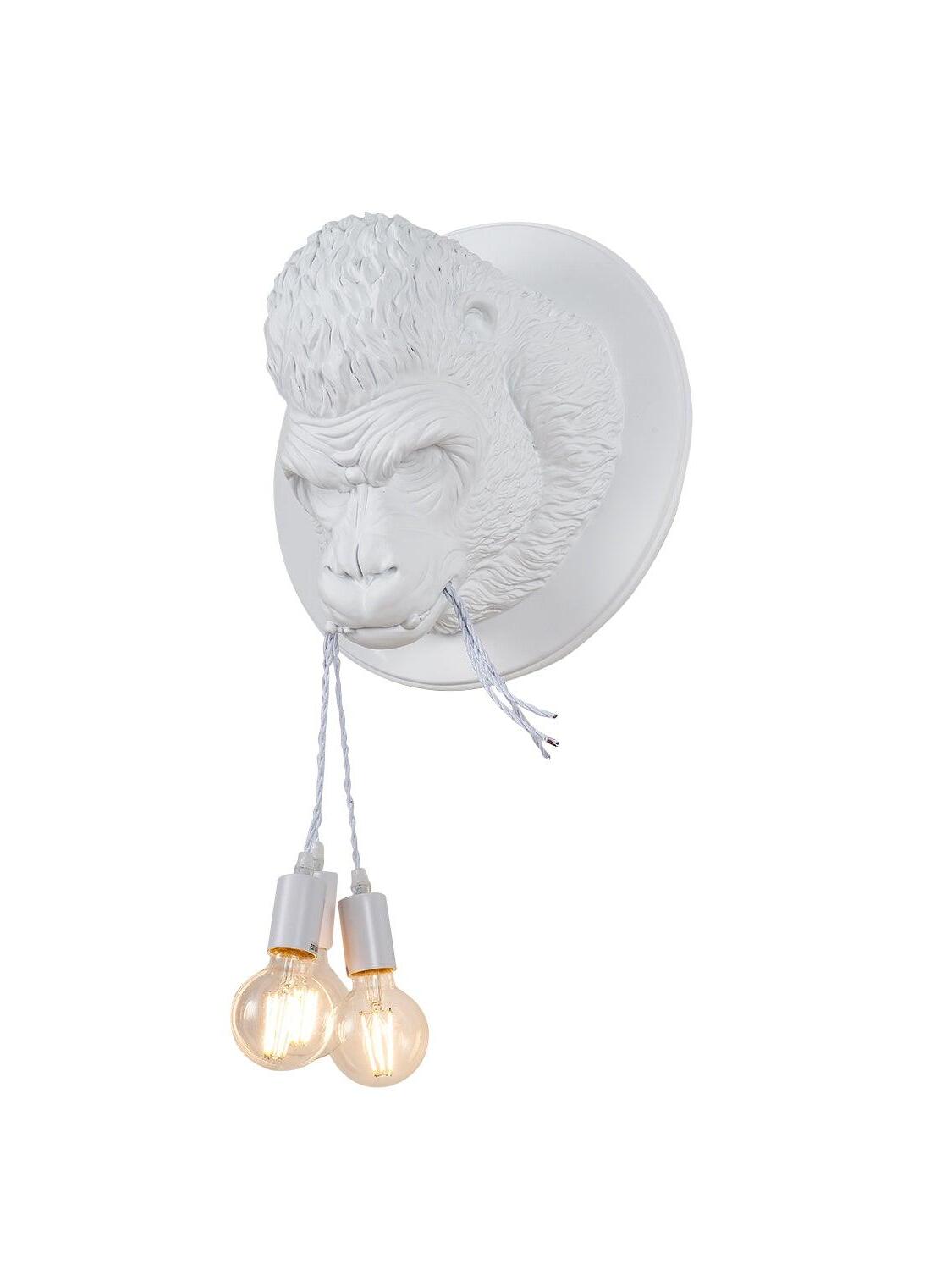 White gorilla head on circular backing with hanging round bulbs and pale cords