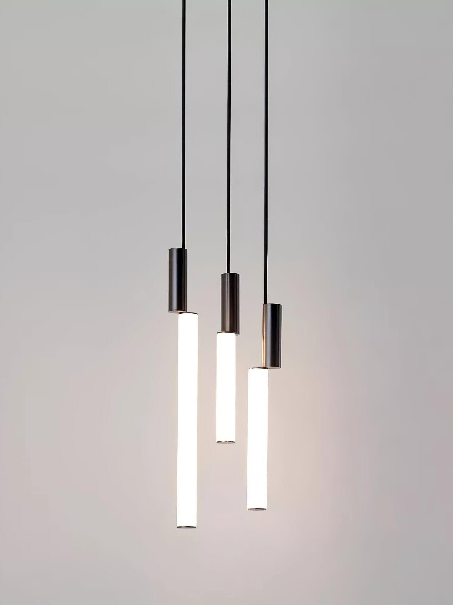 Three black-top glowing rods in a pendant group