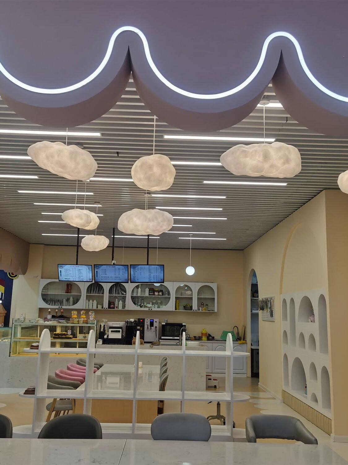 Cloud pendant arrangement in a decorated shop interior