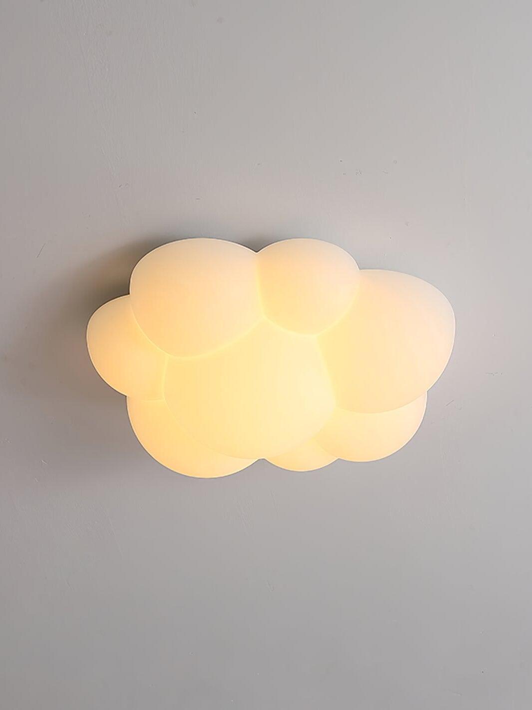 Nuage cloud light glowing warm yellow against a grey ceiling