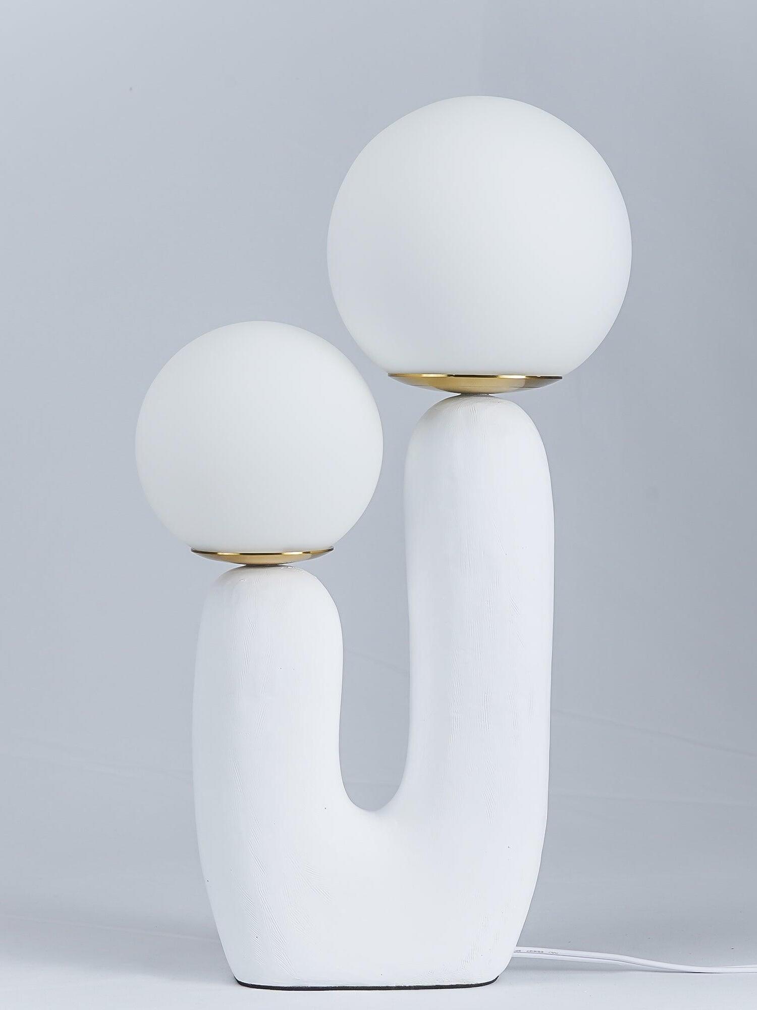 White Oo Rough lamp against grey with unlit-looking opal globes, textured U-shaped body and metal collars