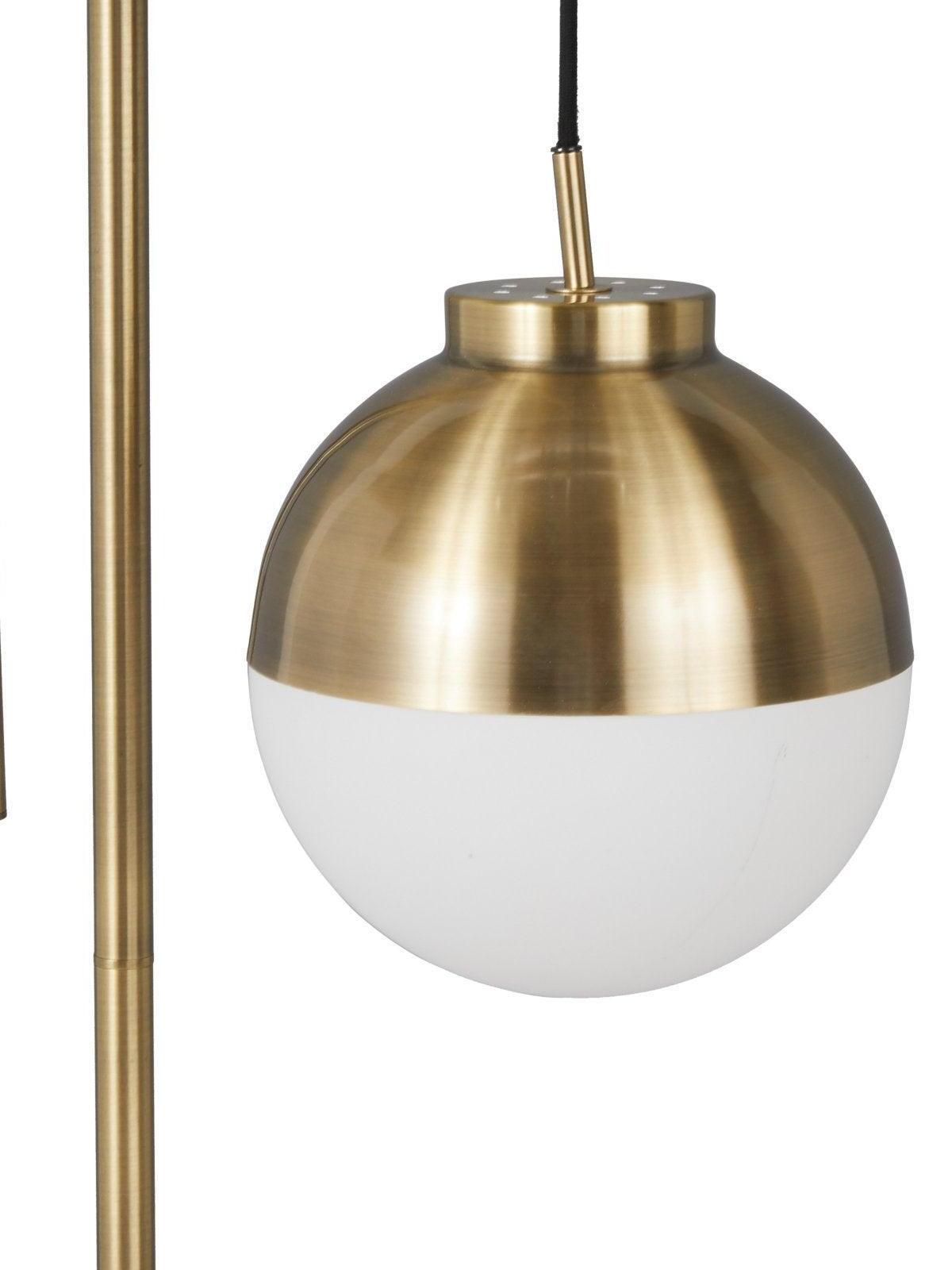 Waterloo gold-colour metal cap and frosted-glass globe close-up