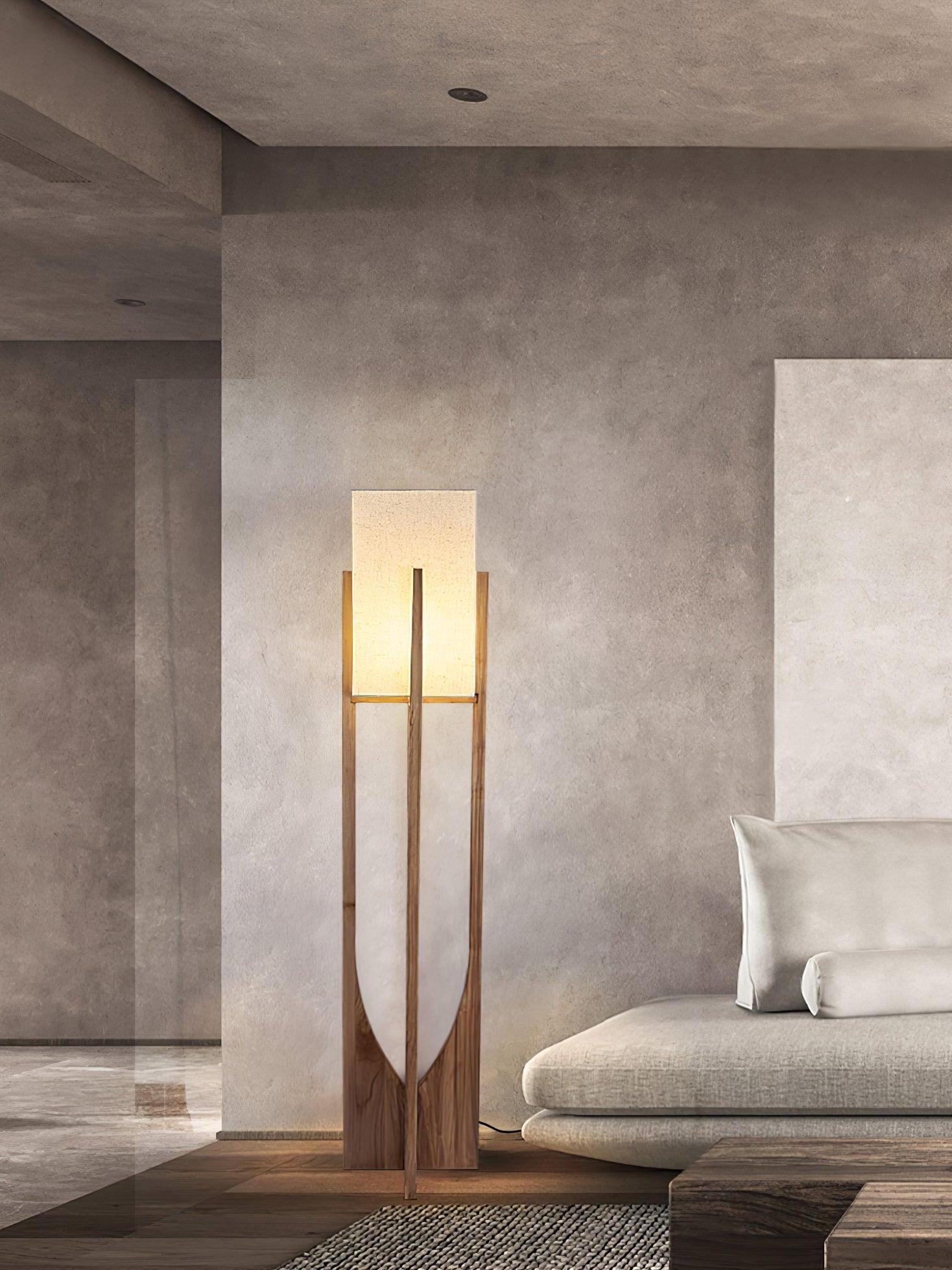 Tall wood frame lamp beside sofa