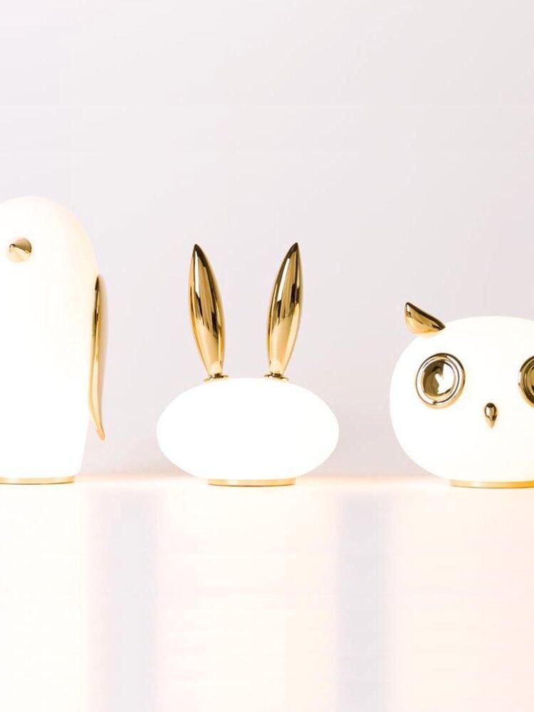 Bright animal lamp group with long-eared rabbit between cropped penguin and owl