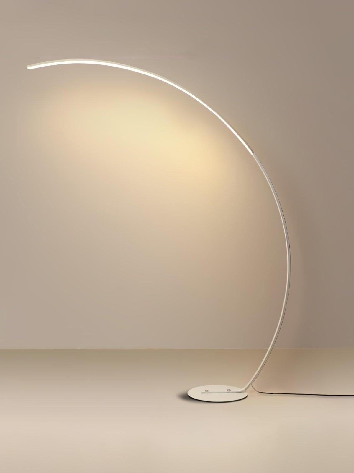 White arc LED floor lamp on pale background