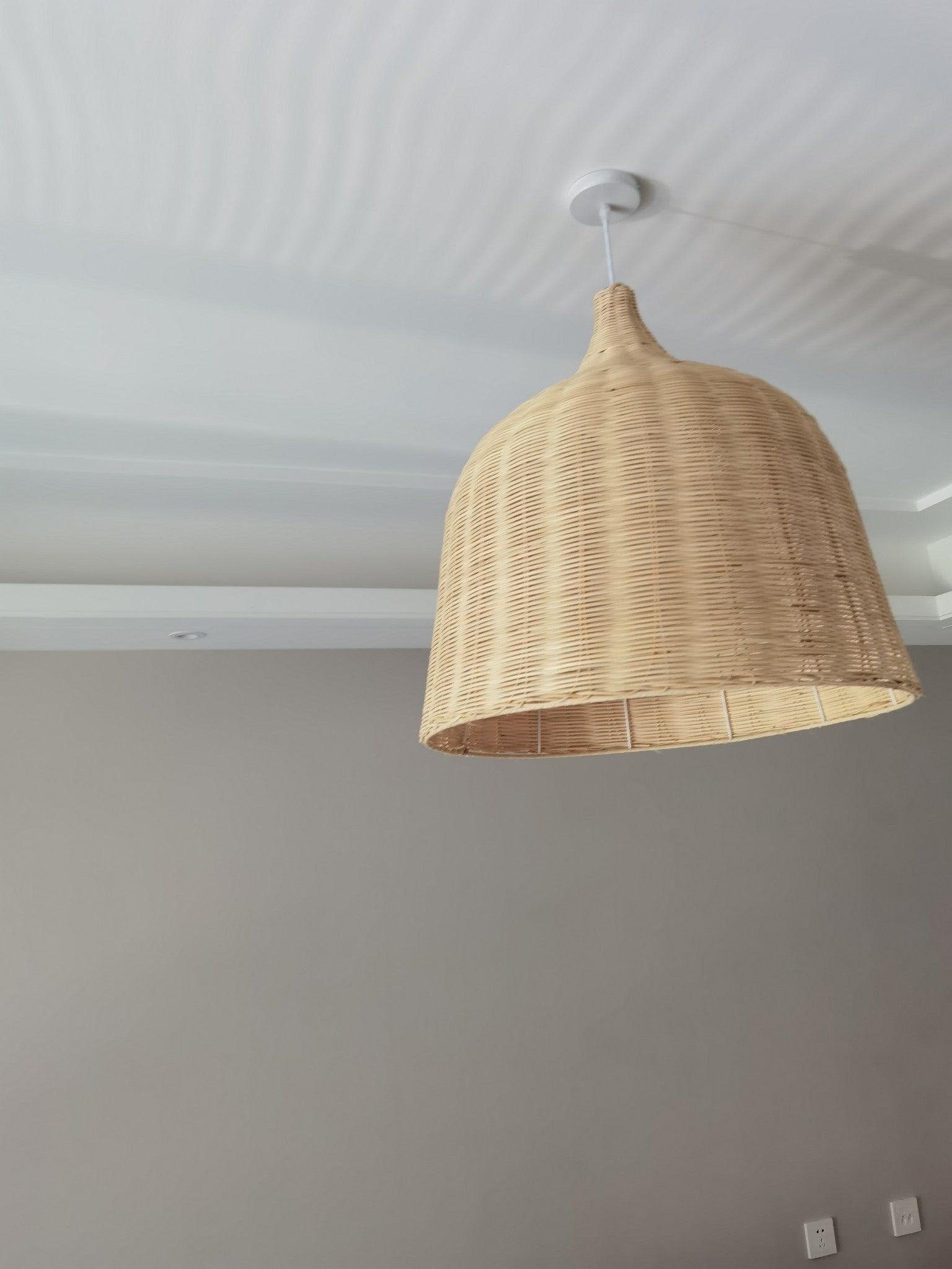 Woven bell pendant near a ceiling corner