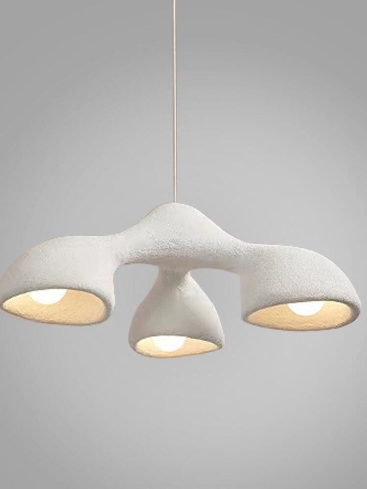 Compact white forked pendant with three glowing bell openings and a central hanging line