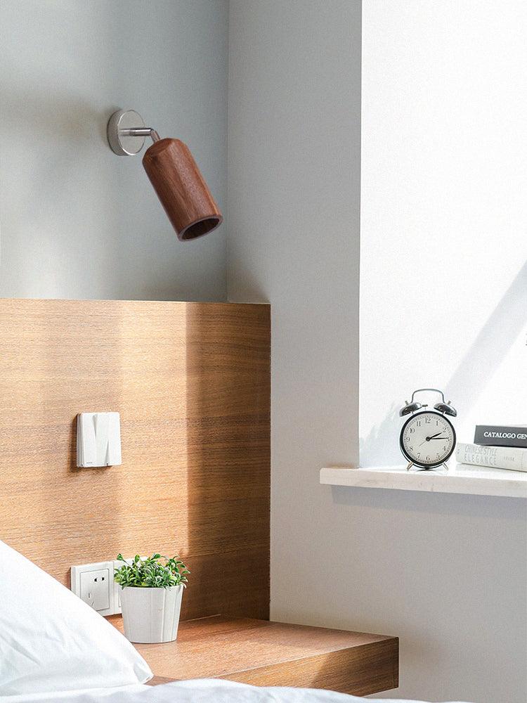 Wall-mounted wood spotlight shown in room photo