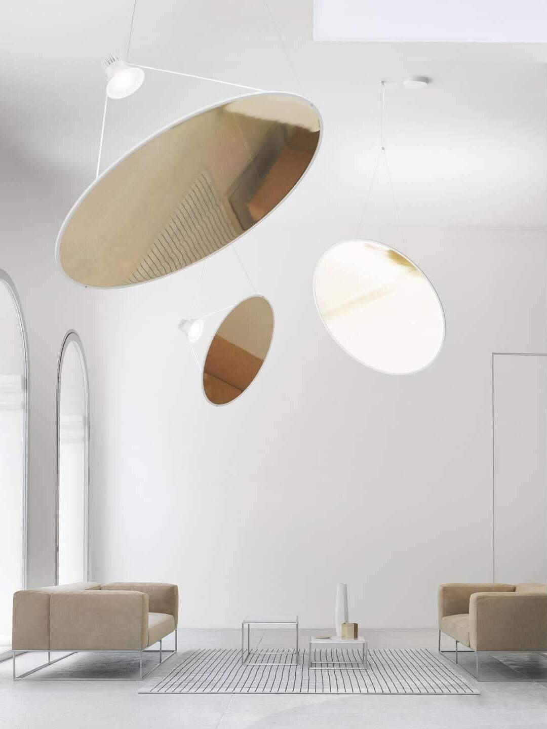 Gold and pale suspended discs in a bright interior