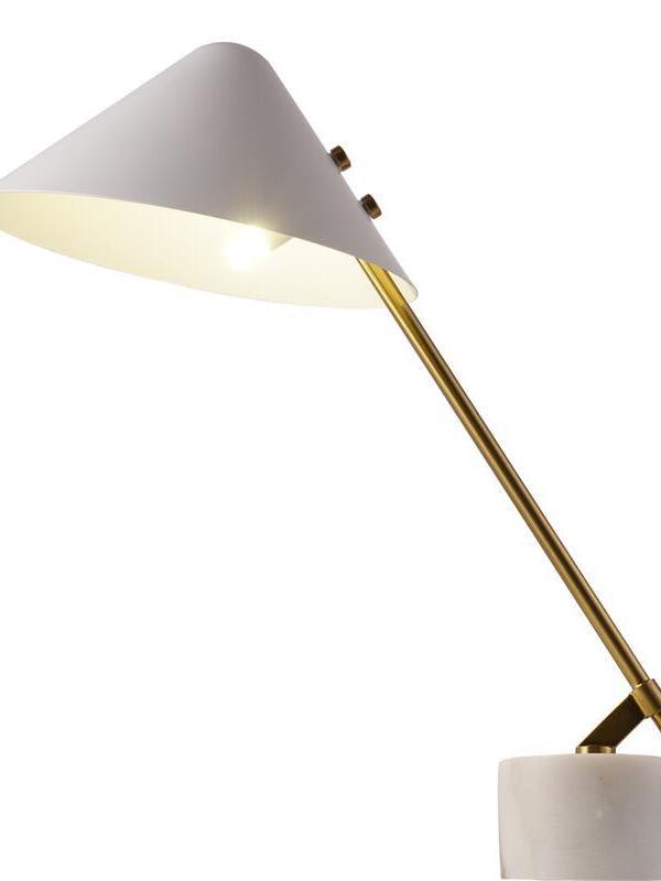 Close side view of illuminated white shade, diagonal gold-tone arm and base fitting
