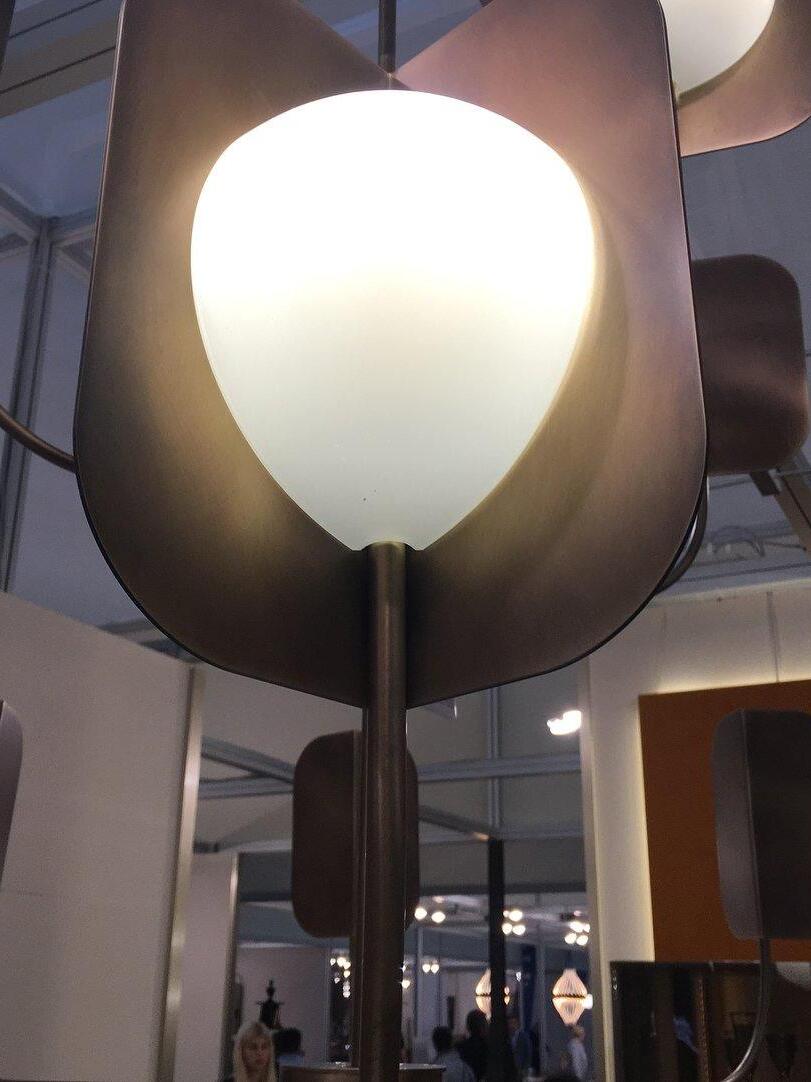 Rounded white light in front of a curved metal shield