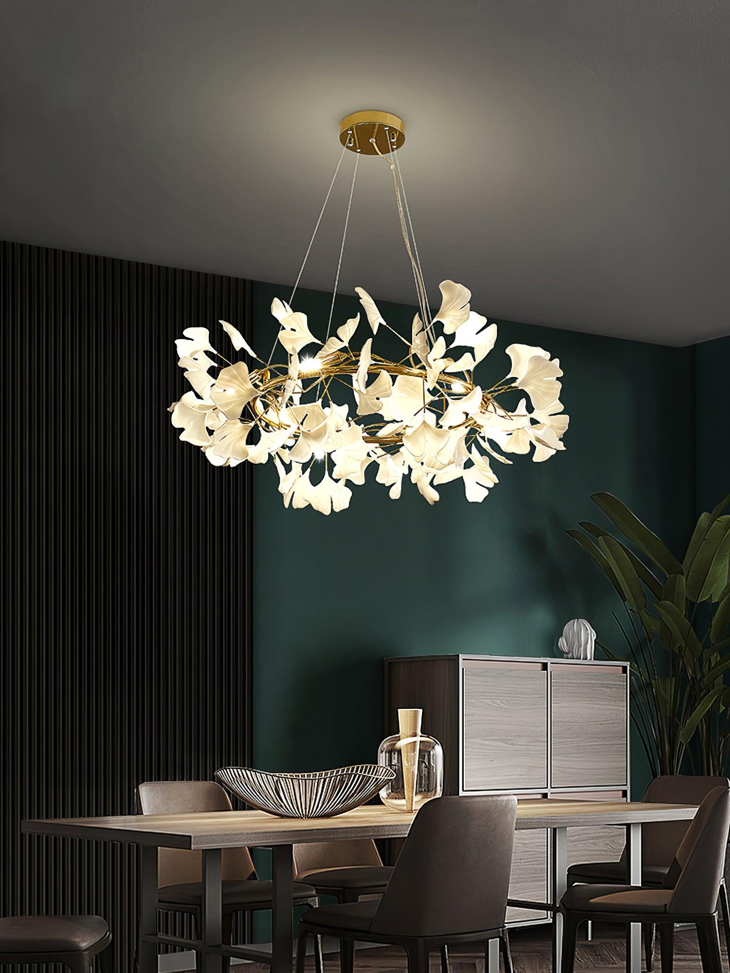 Gingko O chandelier above a dark dining area