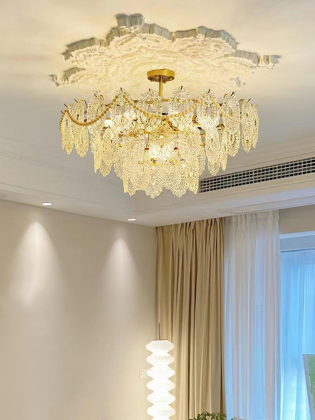 Gold chandelier under decorative interior ceiling