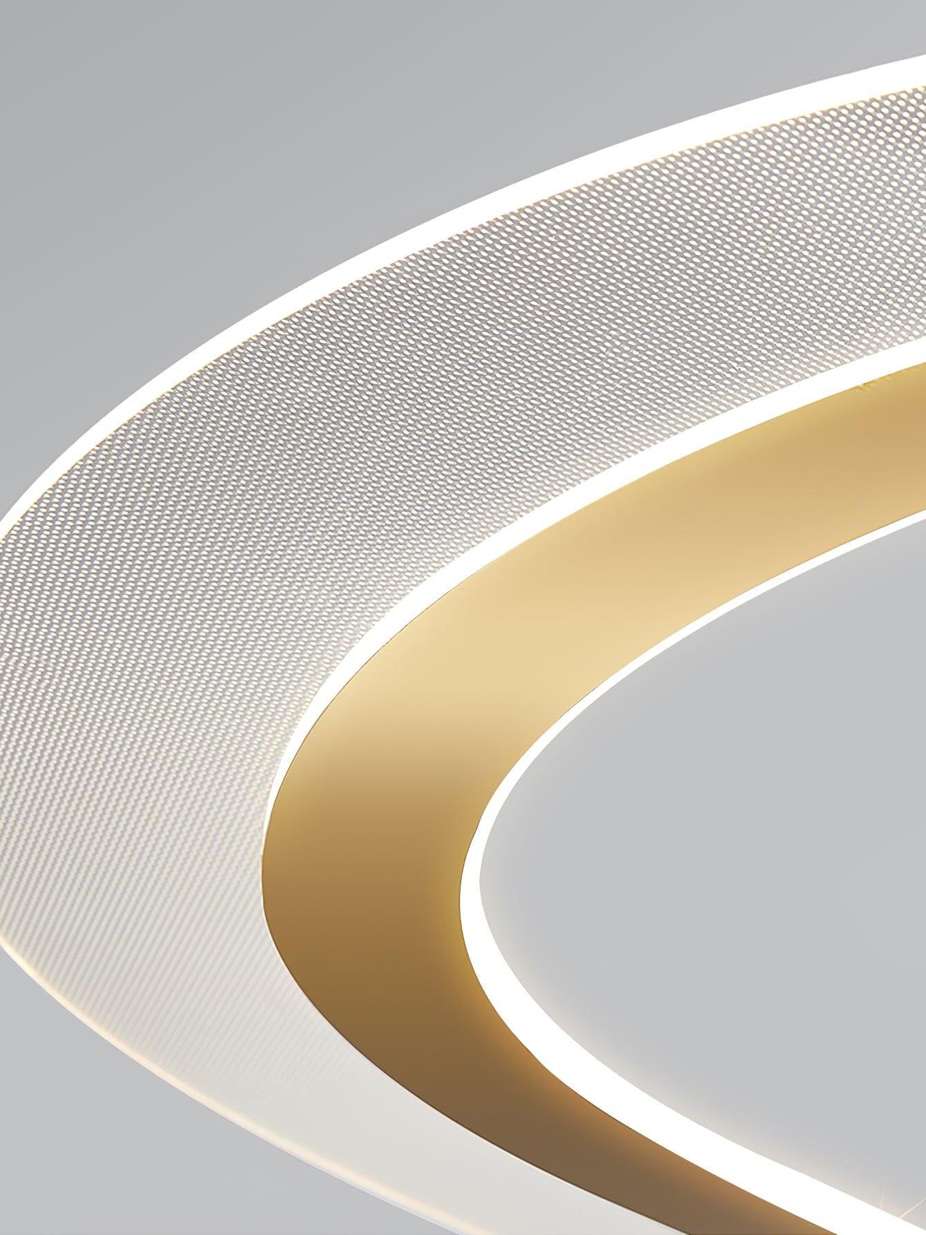 Close view of the lit patterned band and gold-tone trim