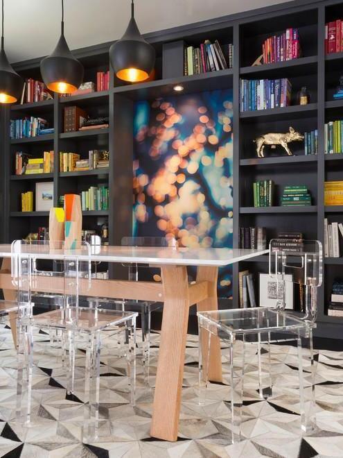 Black pendants above a table near shelves