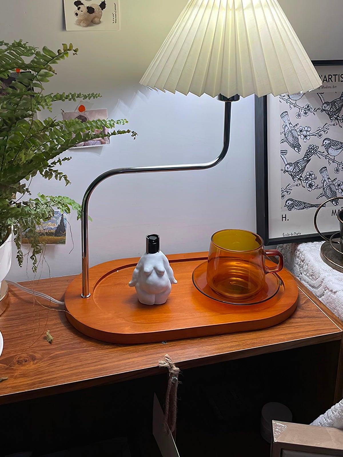 Beige pleated shade and tray beside flowers