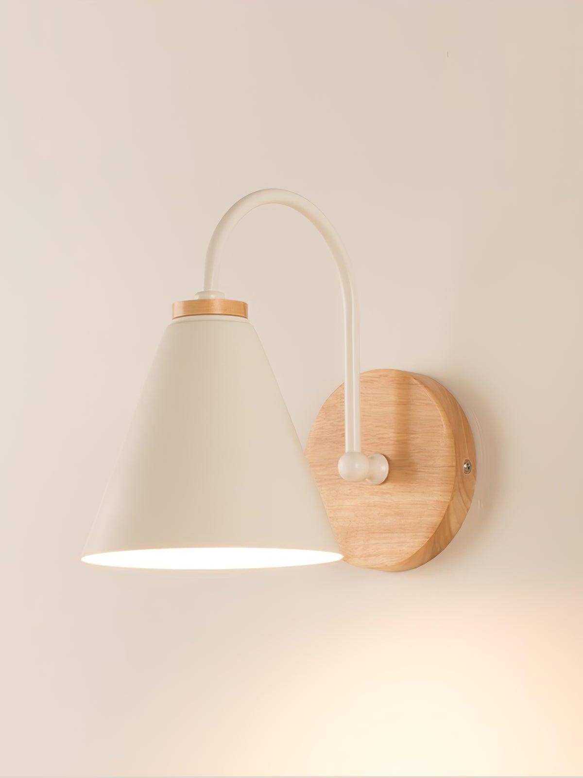White Kona wall lamp with curved arm and round wood plate