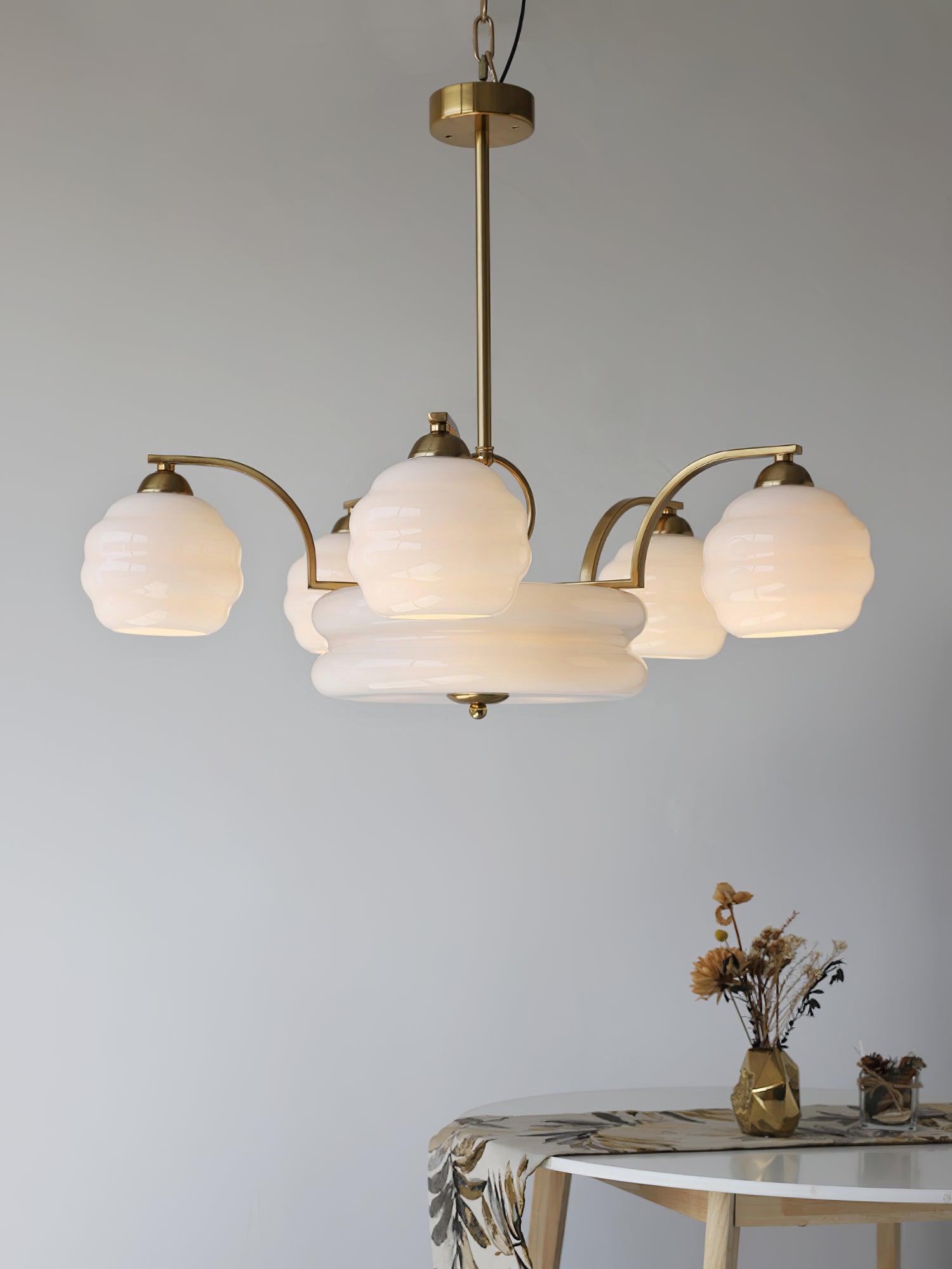 White glass and Gold finish chandelier in an interior