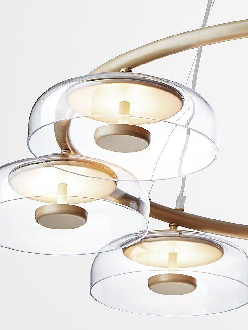Close-up of clear glass shades and gold LED elements