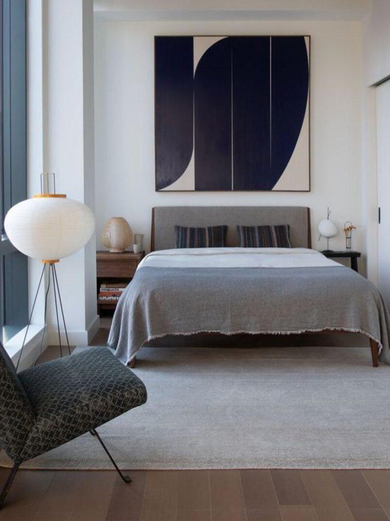 Round paper lamp near bed