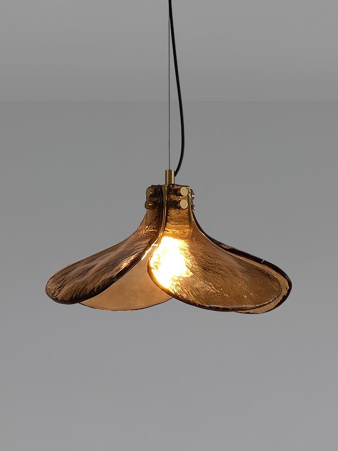 Lit LS185 brown glass pendant against grey backdrop
