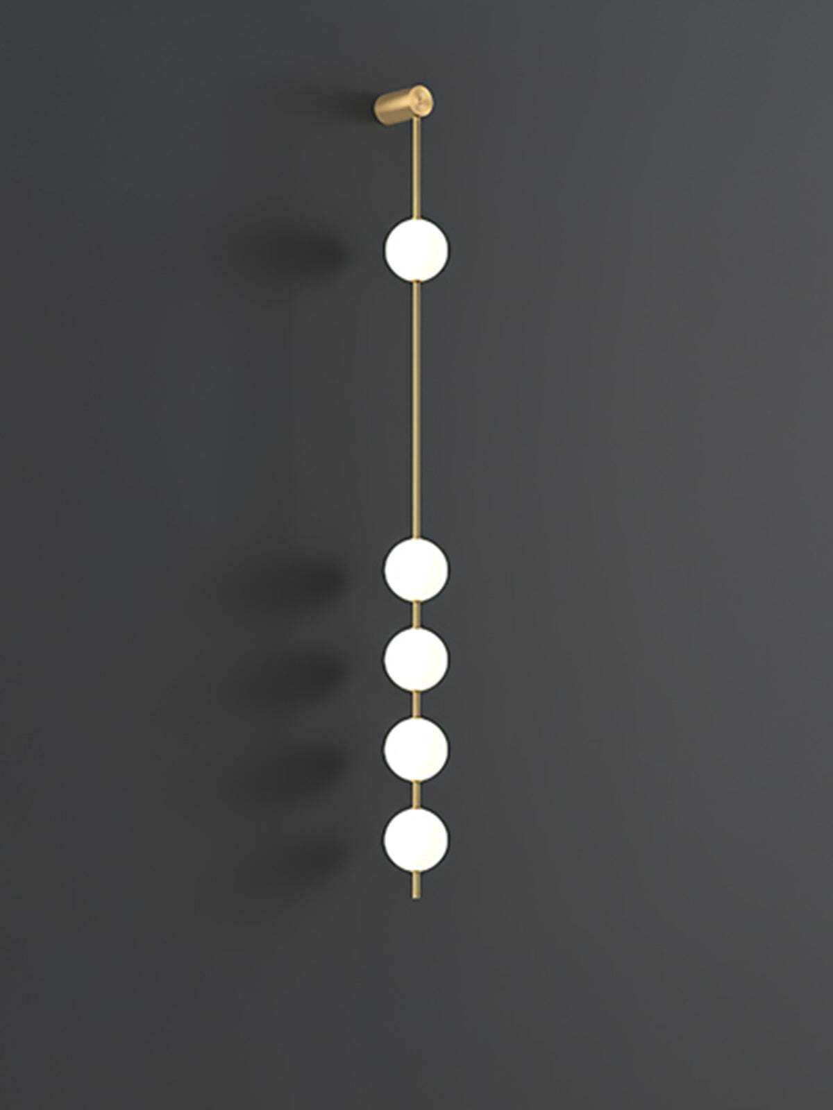 Enlarged five-globe wall lamp with lit white spheres on a gold-colour rod against dark grey