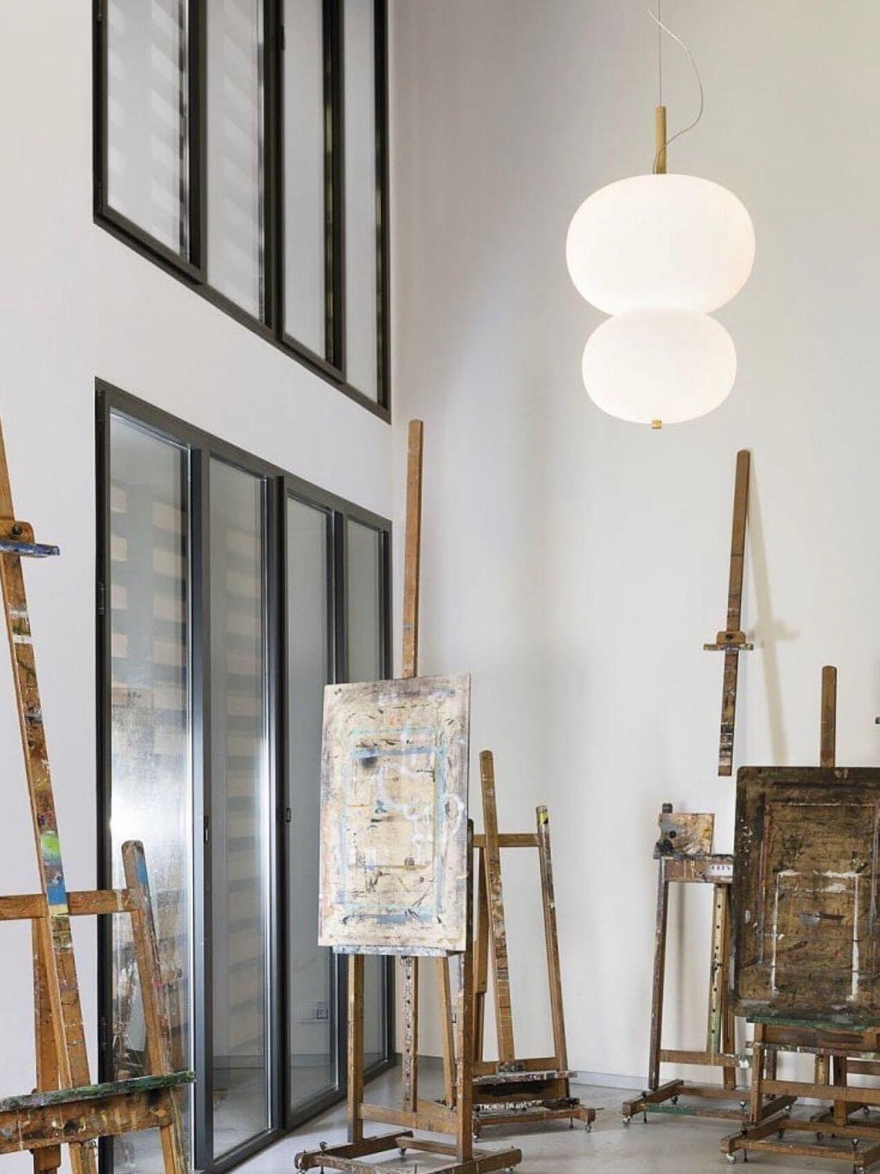 Stacked white globes in a studio interior