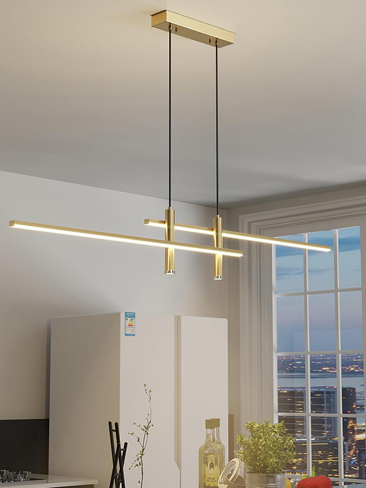 Gold offset-bar pendant near a bright window