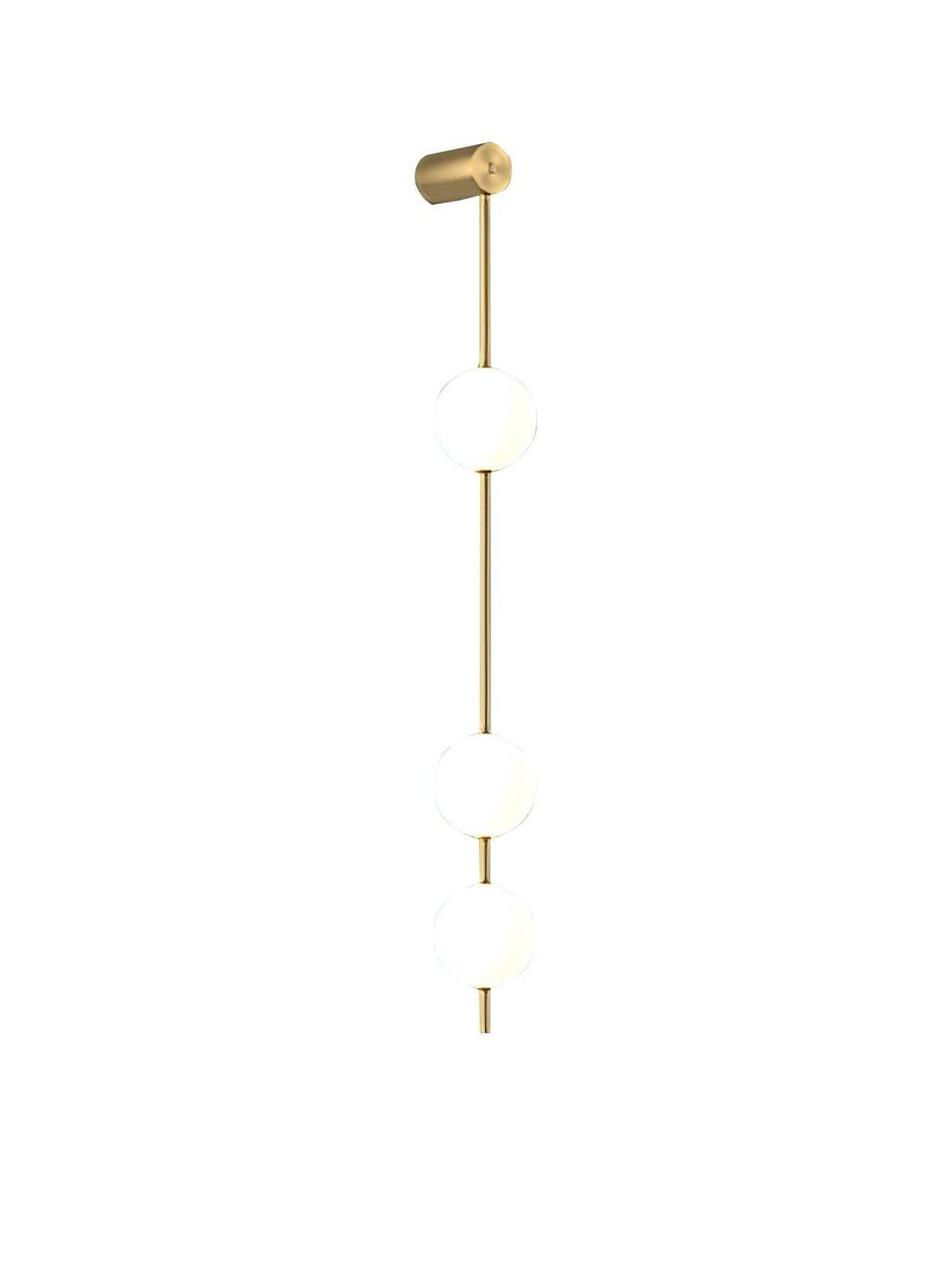 Front view of three white globes, gold-colour rod and upper cylindrical wall fitting against white