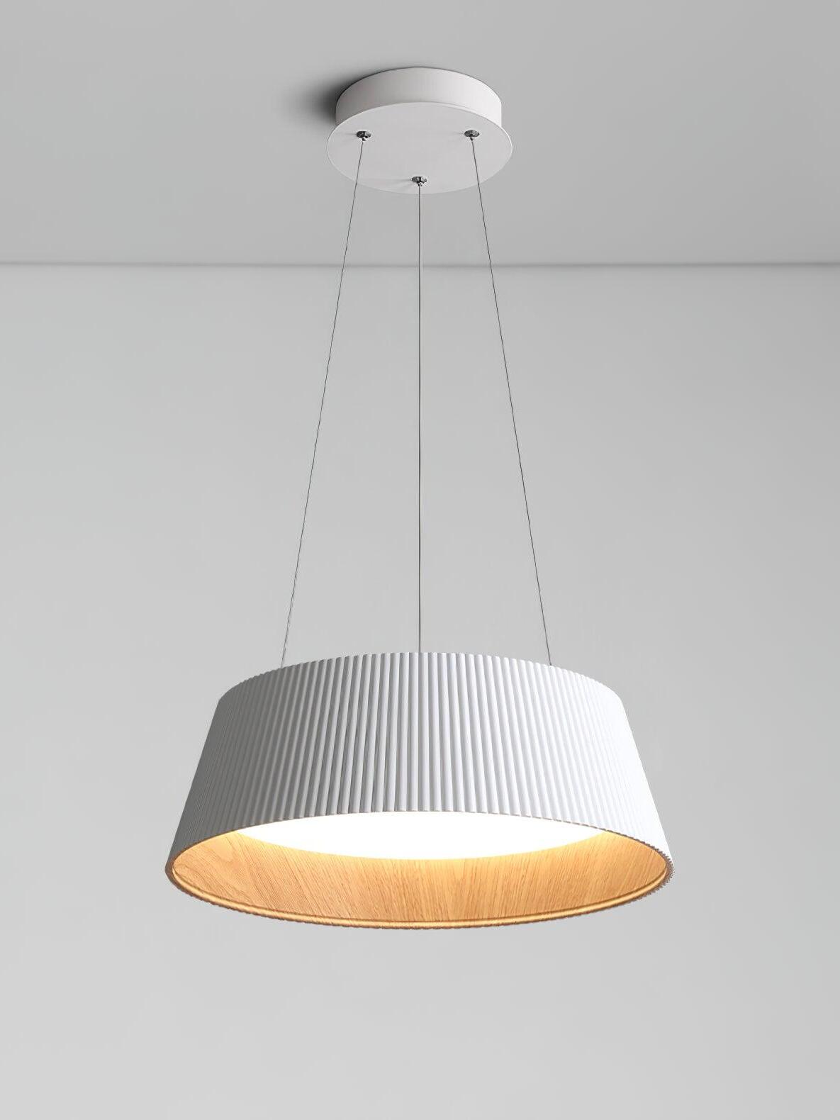 White Modern Ribbed pendant with matching round canopy, three slim lines, tan inner surface and glowing white diffuser
