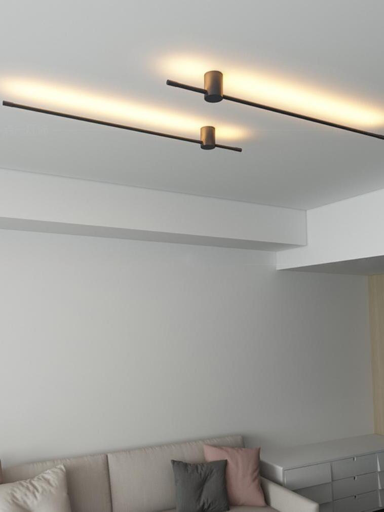 Close room view of paired linear ceiling lights