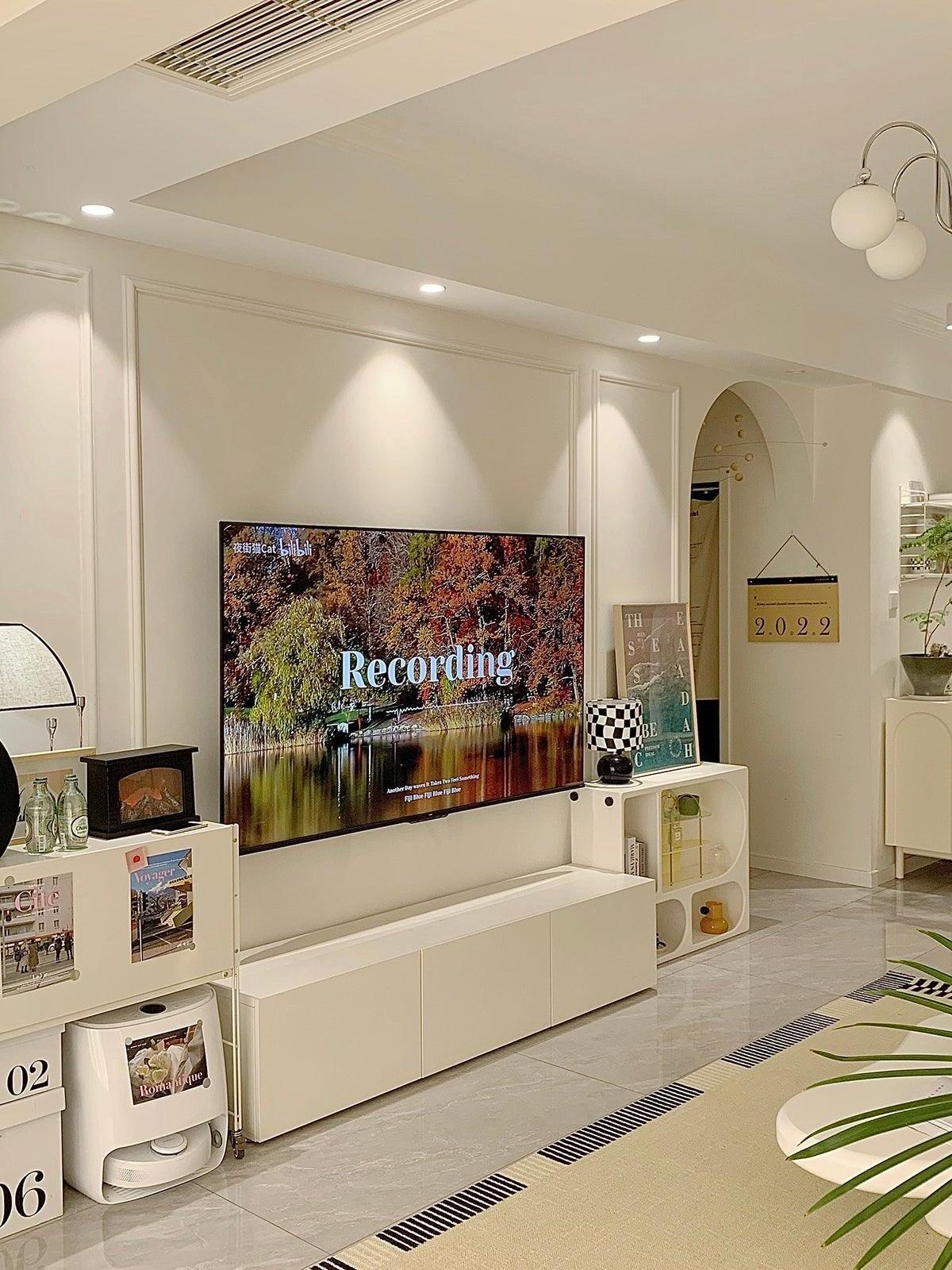 Javier table lamp at left of living room television