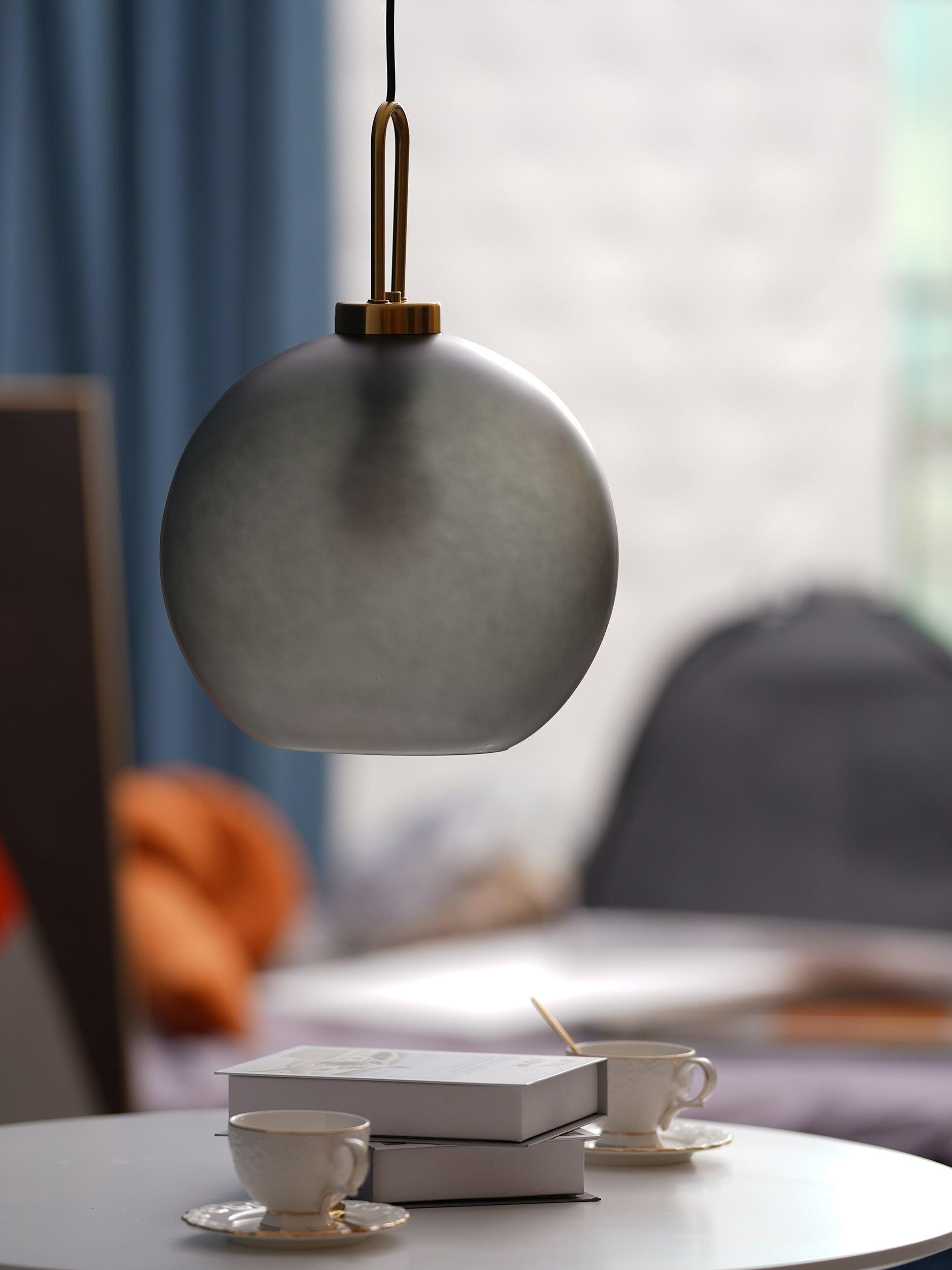 Grey frosted glass shade beside a bright window