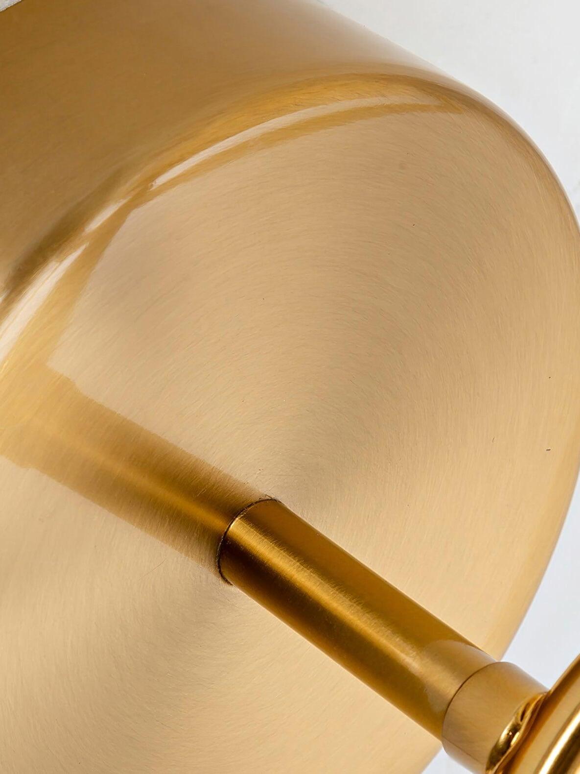 Brushed gold wall plate and support arm detail