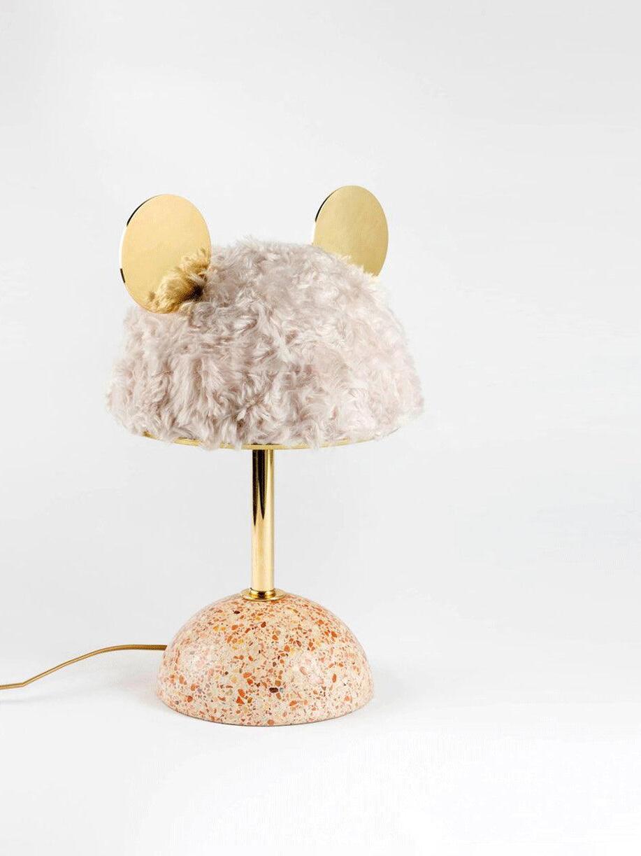 Closer pale plush lamp with reflective discs, slim stem and warm-toned terrazzo base