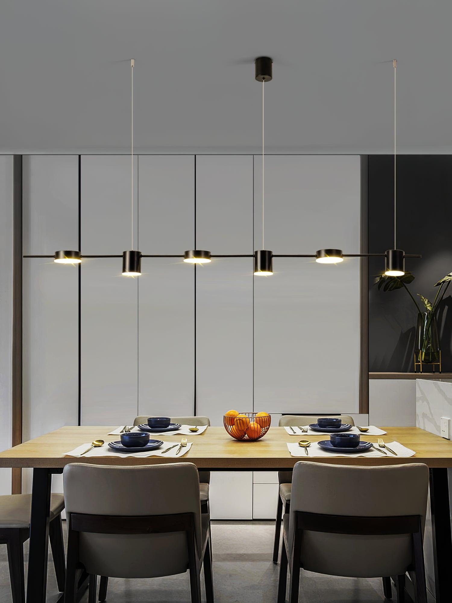 Black linear light above a table with bowls