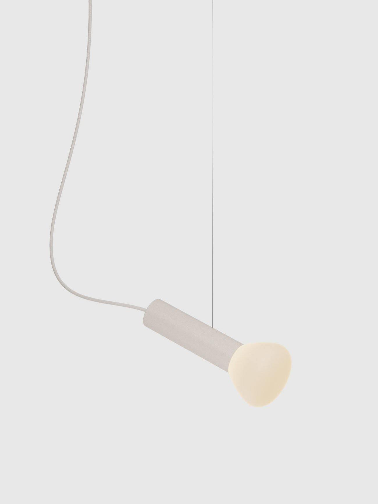 White single-tube pendant angled beneath a cord