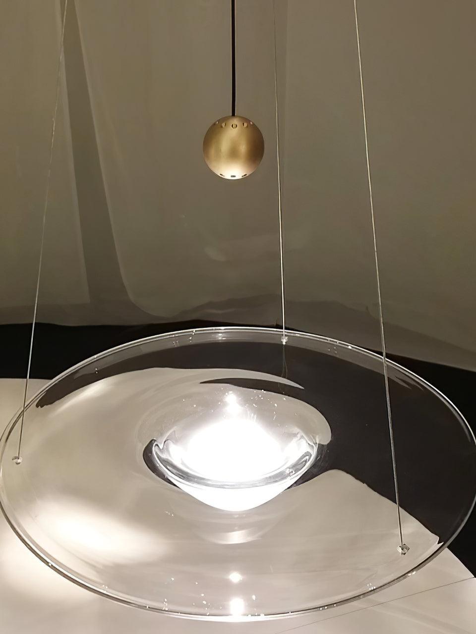 Brass ball and glowing bowl above glass disc