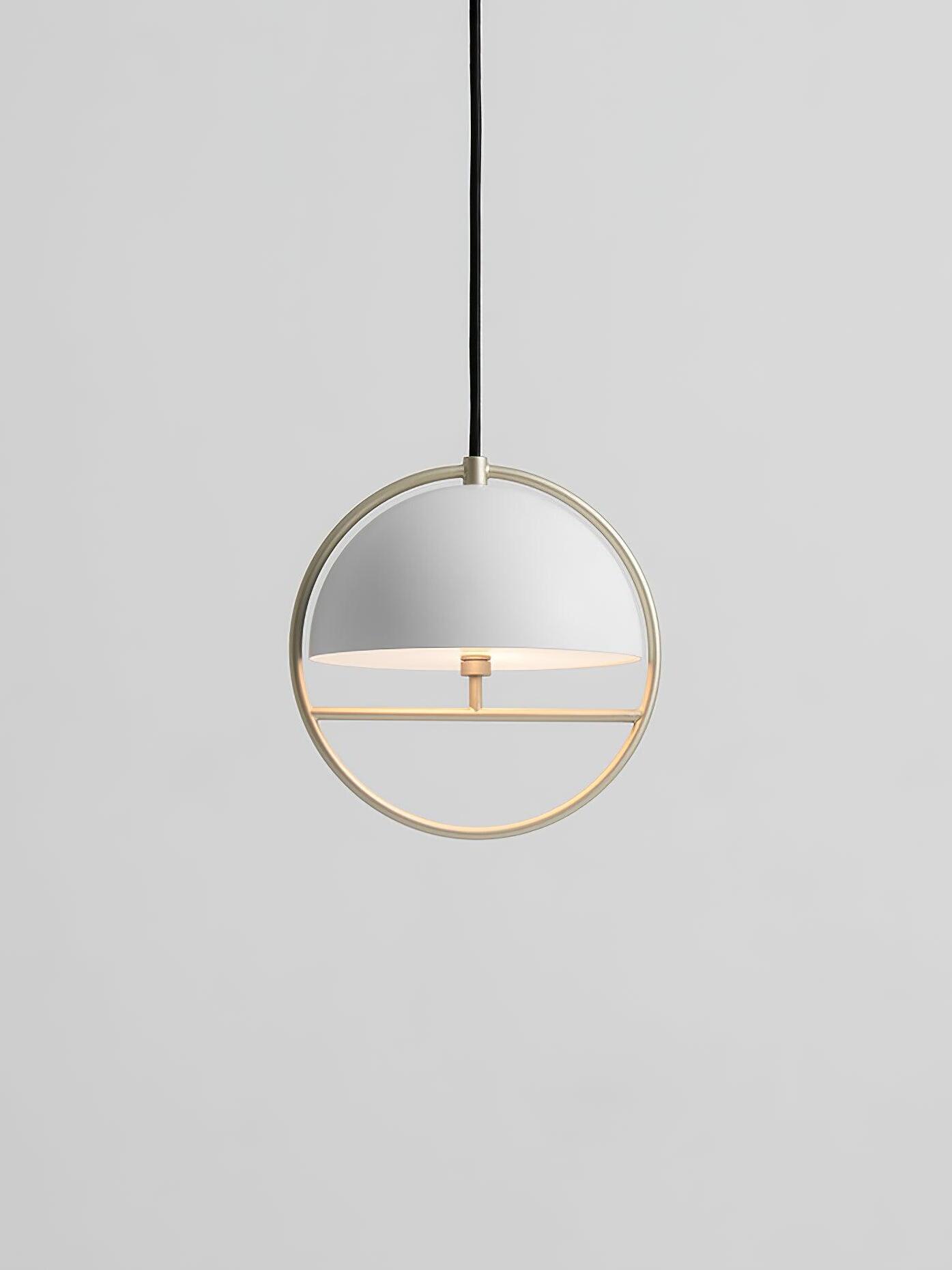 White dome and gold ring hanging on dark cord