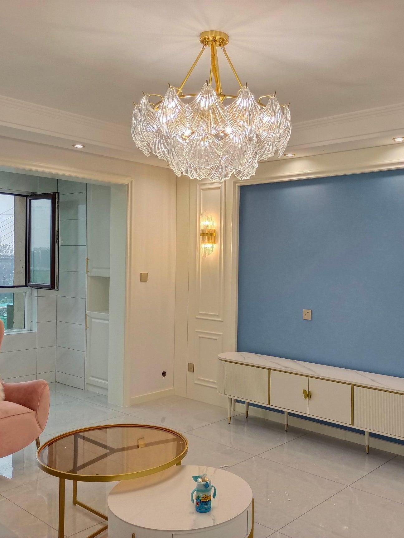 Ribbed glass ceiling light in a blue-walled living room with a television cabinet and round coffee table