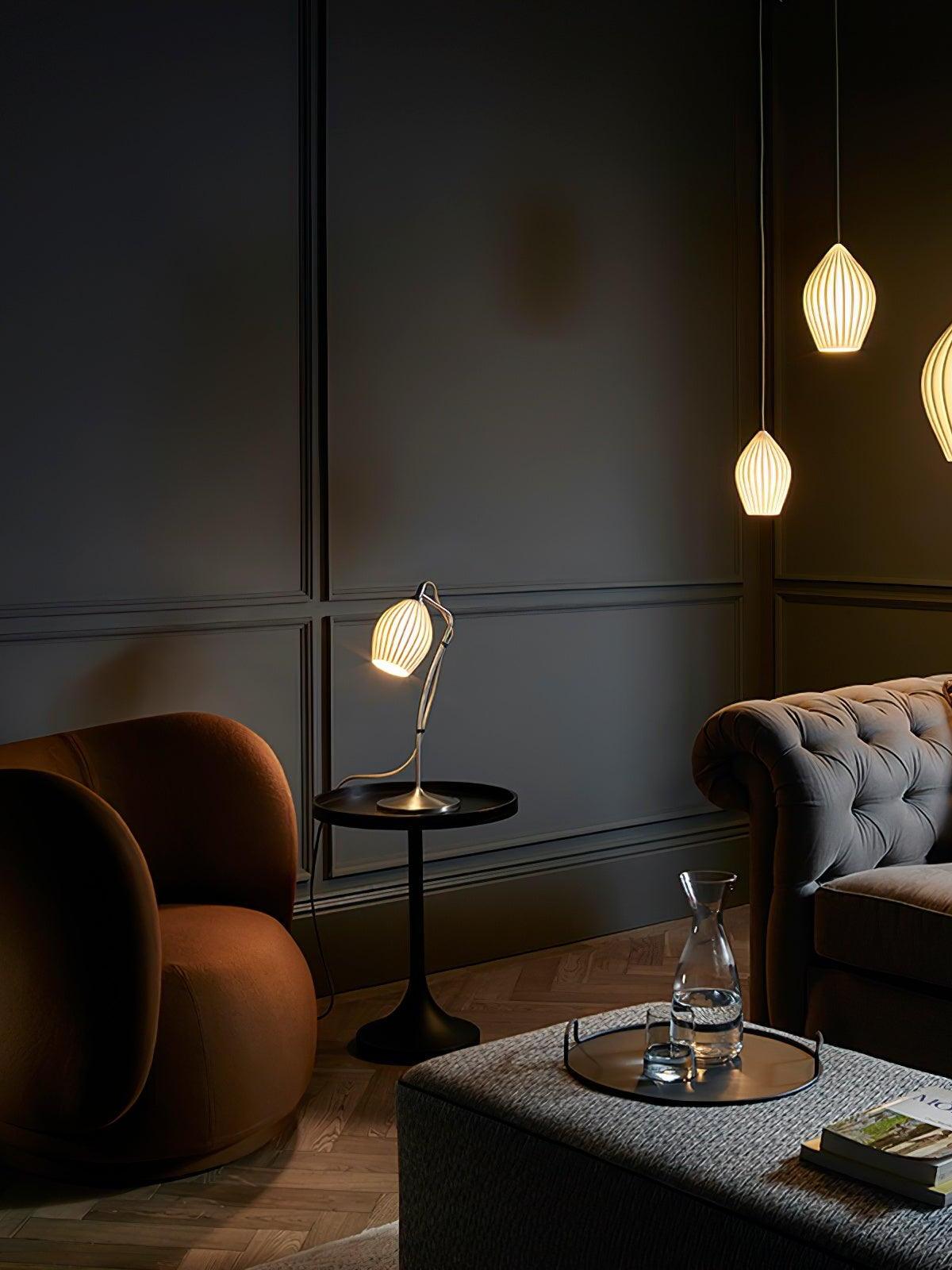 Glowing ribbed pendants beside armchairs and a sofa in a dark panelled room
