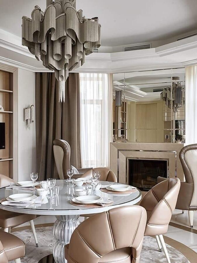 Wavy layered chandelier above a round table
