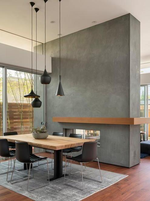 Mixed black pendant shapes in a dining corner