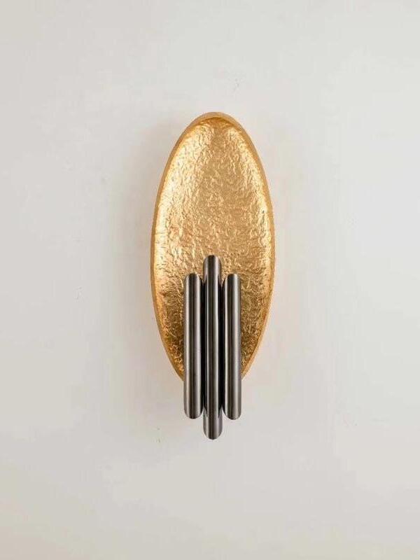 Front Black and Gold option with textured oval and dark metallic tubes